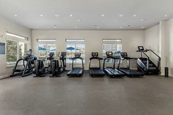 24-Hour fitness center with cardio and weight training equipment