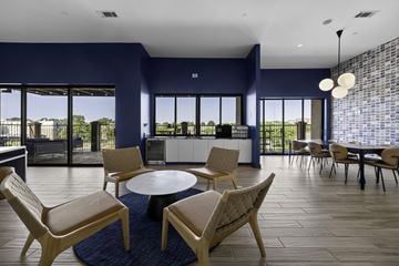 Nashville apartment for rent - A modern living room with a round table and chairs.