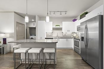 European-style cabinetry in kitchen and bathrooms