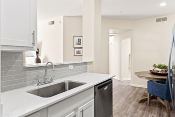 Designer lighting and kitchen gooseneck faucets