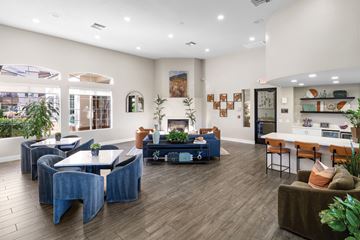 Phoenix apartment for rent - A living room with a blue couch and a coffee table.