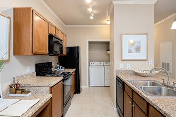 Cordillera ranch apartments - chef kitchen with black whirlpool appliances