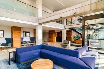 Minneapolis apartment for rent - a living room with a blue couch and a coffee table