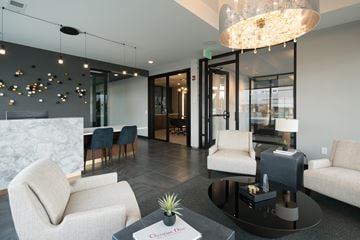 Edina apartment for rent - a living room with couches and chairs and a table
