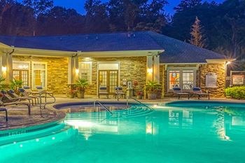 The oaks at johns creek swimming pool at dusk