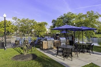 Grilling station area with picnic tables and seating