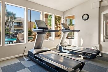 24-Hour fitness center with the latest cardio and weight training equipment and a sauna
