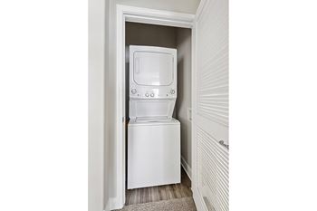 Full-sized stackable washer/dryers in unit