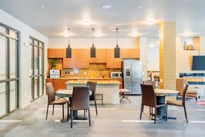 North Charleston apartment for rent - Centre Pointe Apartments clubhouse kitchen area with a breakfast bar and tables