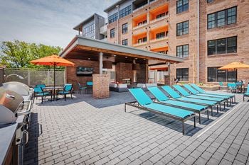 Outdoor grill station and fireplace with seating area