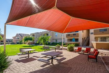 Bbq grill and covered outdoor lounge area