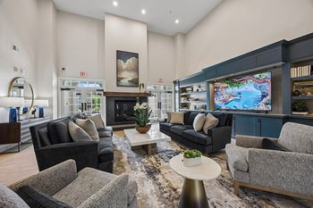 Resident clubhouse with fireplace and kitchen