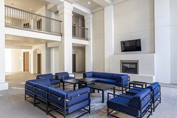 Covered outdoor cabana with fireplace, tv and conversation area