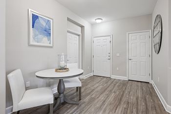 Wood-style flooring in kitchen, entry and bath