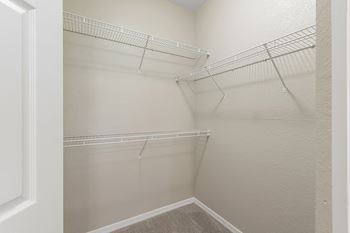 Spacious walk-in closets with ventilated shelving