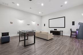 Colorado Springs apartment for rent - Game room with foosball and arcade games - First and Main Apartments