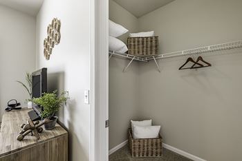Spacious walk-in closets with custom-designed wire shelving