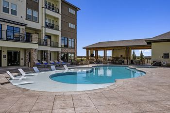 Resort-style heated pool and spa with baja deck