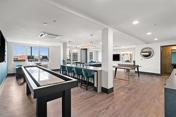 Game room with billiards table, ping pong, shuffleboard, arcade games and kitchenette