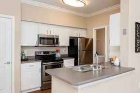 Overland Park apartment for rent - Weston Point Apartments - Fully-equipped kitchen with above range microwaves and refrigerators with icemakers