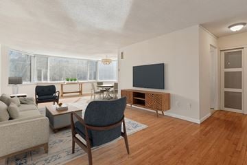 Philadelphia apartment for rent - A living room with a grey chair and a grey sofa.
