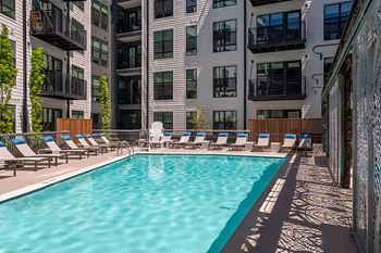 Resort-style swimming pool with sun shelf