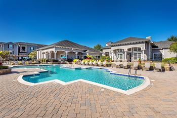 Resort-style swimming pool with spacious sundeck