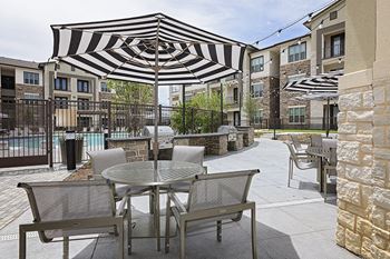 Outdoor bbq grilling stations and a fire pit