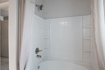 Crescent shaped shower rods with oversized shower heads
