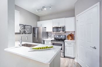 Chef-inspired kitchen with modern faucet and under-mounted sink