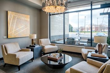 Expansive club room with kitchen and dining area, lounge seating, fireplace and tvs