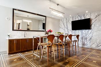 Entertaining kitchen featuring a marbled topped communal table