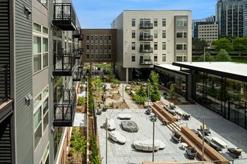 Two outdoor courtyards with fire pit lounge and games