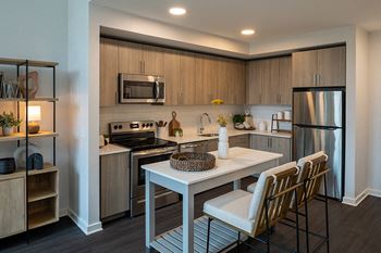 Designer kitchens with quartz countertops and stainless steel appliance appliances
