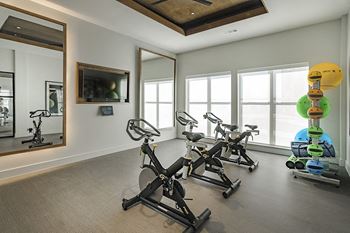 24-Hour fitness center with cardio and weight equipment