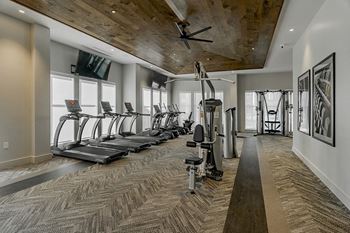 24-Hour fitness center with cardio and weight equipment