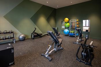 State-of-the-art fitness center with private workout pads, free weights and fitness on demand