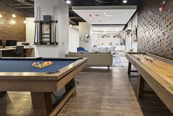 Game room with billiards and shuffleboard