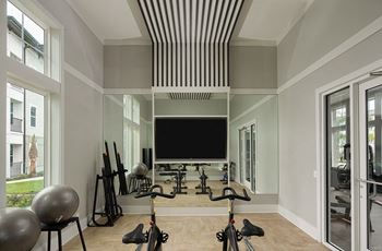 Yoga studio and private training room featuring virtual fitness classes