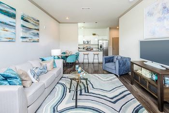 Hardwood-style flooring throughout and carpet in bedrooms