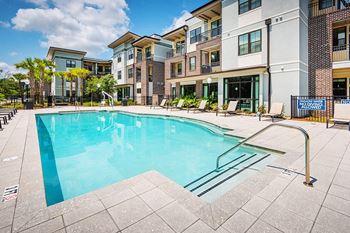 Resort-style pool with tanning deck