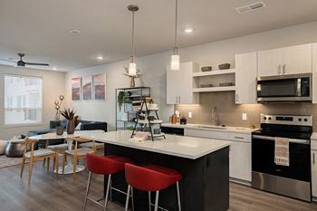 Quartz countertops and tile backsplash