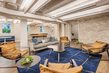 Inviting resident lounge with shuffleboard, table tennis and kitchenette