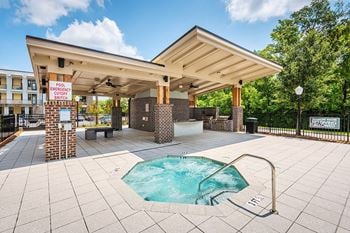 Spa with outdoor fire pit and lounge area
