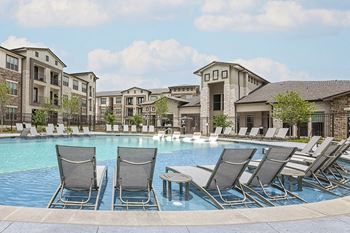 Poolside tanning sundeck with lounge seating