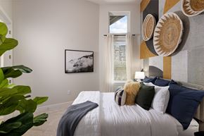 Golden apartment for rent - A bedroom with a large bed and a painting on the wall.