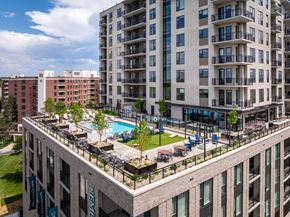 Englewood apartment for rent - A large building with a pool in the middle of it.