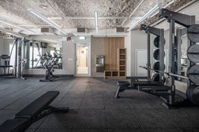 North Vancouver apartment for rent - a gym with weights machines and a door