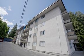 Abbotsford apartment for rent - A white building with a balcony on the second floor.