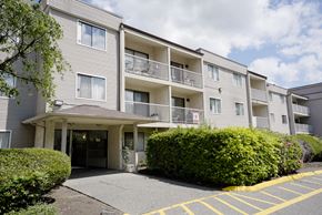Abbotsford apartment for rent - Apartment building with a parking lot in front.
